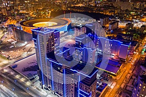 Aerial view of stadium with night illumination and residential buildings in the center of Yekaterinburg. Russia