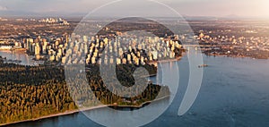 Aerial View of Stanley Park and Downtown Vancouver City on Ocean Coast. Sunset