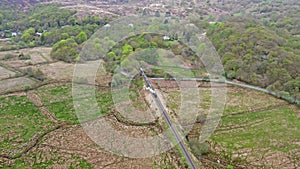 Aerial view of Steamtrain driving through the Snowdonia National Park in Wales - United Kingdom