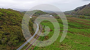 Aerial view of Steamtrain driving through the Snowdonia National Park in Wales - United Kingdom