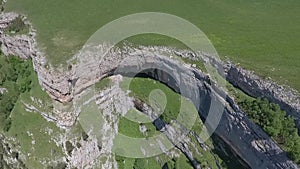 Aerial view of the steep walls of the stone plateau