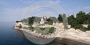 Aerial view of Stevns cliff and Hoejerup Old Church, Denmark