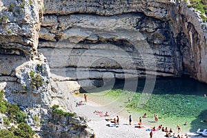 Aerial view on Stiniva Beach, Adriatic Sea bay, people relaxing on the beach, Vis, Vis Island, Croatia