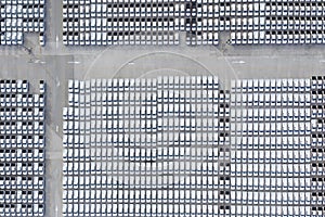 Aerial view of stock new cars parking in industrial zone