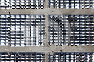 Aerial view of stock new cars parking in industrial zone