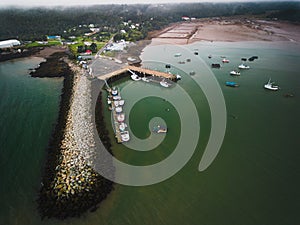 Aerial view of the stone harbor and boats.