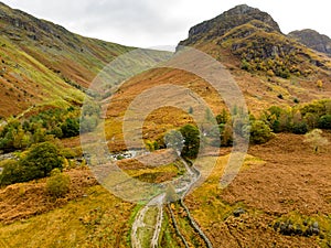 Aerial view of Stonethwaite Beck, a small river formed at the confluence of Langstrath Beck and Greenup Gill beneath Eagle Crag photo
