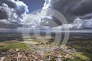 Aerial View of Stormy Clouds Over a Northern Italian Village