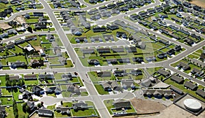 An aerial view of the street in a modern residential subdivision.