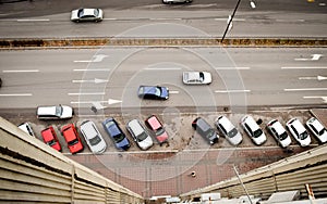 Aerial view on street with parking lot and cars