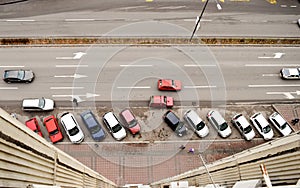 Aerial view on street with parking lot and cars