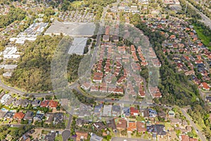 Aerial view of streets, cul-de-sacs, houses and rooftops in the suburb of Menai in Sutherland Shire, Sydney