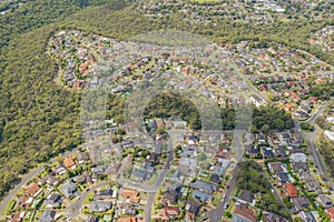 Aerial view of streets, cul-de-sacs, houses and rooftops in the suburb of Menai in Sutherland Shire, Sydney