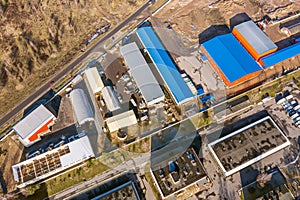 Aerial view of suburb industrial area with group of modern warehouses and factory buildings