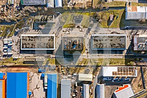 Aerial view of suburb industrial area with group of modern warehouses and factory buildings