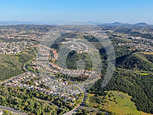 Aerial view suburban neighborhood with identical villas next to each other in the valley. San Diego, California,