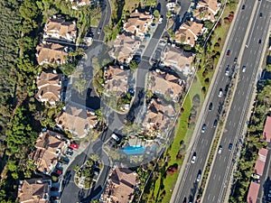 Aerial view suburban neighborhood with identical villas next to each other in the valley. San Diego, California,