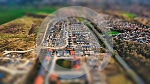 Aerial view of a suburban neighborhood with tilt-shift effect, creating a miniature scene appearance in Harrogate, North Yorkshire