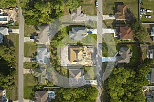 Aerial view of suburban private house wit wooden roof frame under construction in Florida quiet rural area