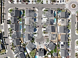 aerial view of a suburban residential area with a paved street