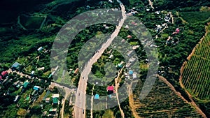 Aerial view on suburban road with cars, trucks and other tranportation in a mountains