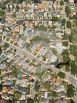 Aerial view of suburbs with shadow of plane
