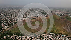 Aerial view of Sulaiman Too Sacred Mountain in Osh city, Kyrgyzstan. The symbol of the city of Osh. Beautiful powerful