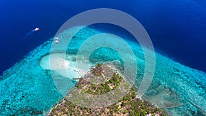 Aerial view of the Sumilon island, sandy beach with tourists swimming in beautiful clear sea water of the Sumilon island beach,