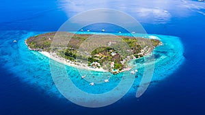 Aerial view of the Sumilon island, sandy beach with tourists swimming in beautiful clear sea water of the Sumilon island beach,