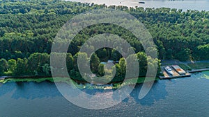 Aerial view summer forest and river in sunny day. Drone shot beautiful nature