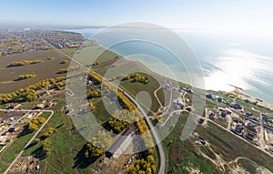 Aerial view of a summer house village at blue sea coast.