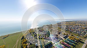 Aerial view of a summer house village at blue sea coast.