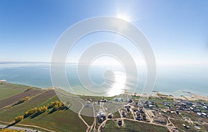 Aerial view of a summer house village at blue sea coast.