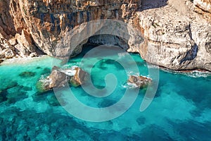 Aerial view summer seascape. Turquoise sea water and rocks top view, Island of sardinia in Italy Travel background