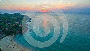 aerial view the sun going down to holison at Karon beach Phuket