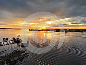 Aerial View of Sun Setting over the Water