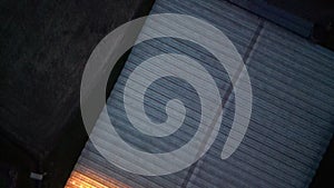 Aerial View of Sunlight Glinting Off Industrial Greenhouse Roof