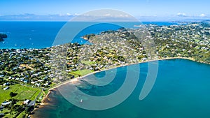 Aerial view on sunny beach with residential houses. Waiheke Island, Auckland, New Zealand