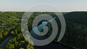 An aerial view A sunny summer evening The Gauja river flows between green forests.