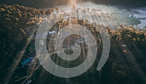 Aerial view of Sunrise with fog over Ban Rak thai, chinese village near a lake in Mae Hong Son, Thailand