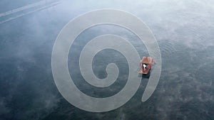 Aerial view of Sunrise with fog over Ban Rak thai, chinese village near a lake in Mae Hong Son, Thailand