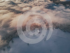 Aerial view of a sunset above the cloud