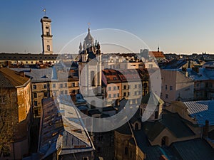 aerial view of sunset above old european city. church bell tower