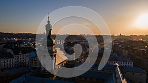 aerial view of sunset above old european city. church bell tower