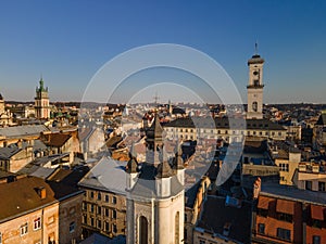 aerial view of sunset above old european city. church bell tower