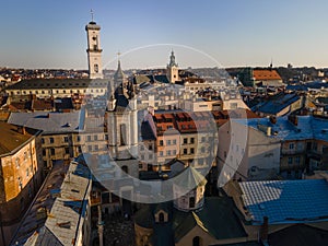 aerial view of sunset above old european city. church bell tower