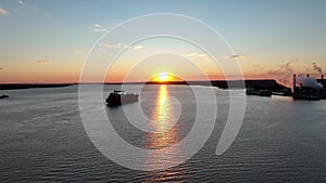 Aerial View of Sunset on Delaware River with Cargo Ship