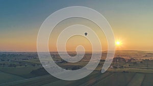 Aerial view of a sunset over farm lands