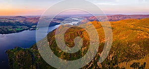 Aerial view of sunset over Ullswater lake in Lake District, a region and national park in Cumbria in northwest England