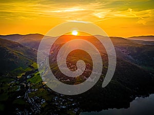 Aerial view of sunset over Ullswater lake in Lake District, a region and national park in Cumbria in northwest England